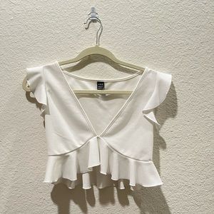 white v-cropped ruffled top